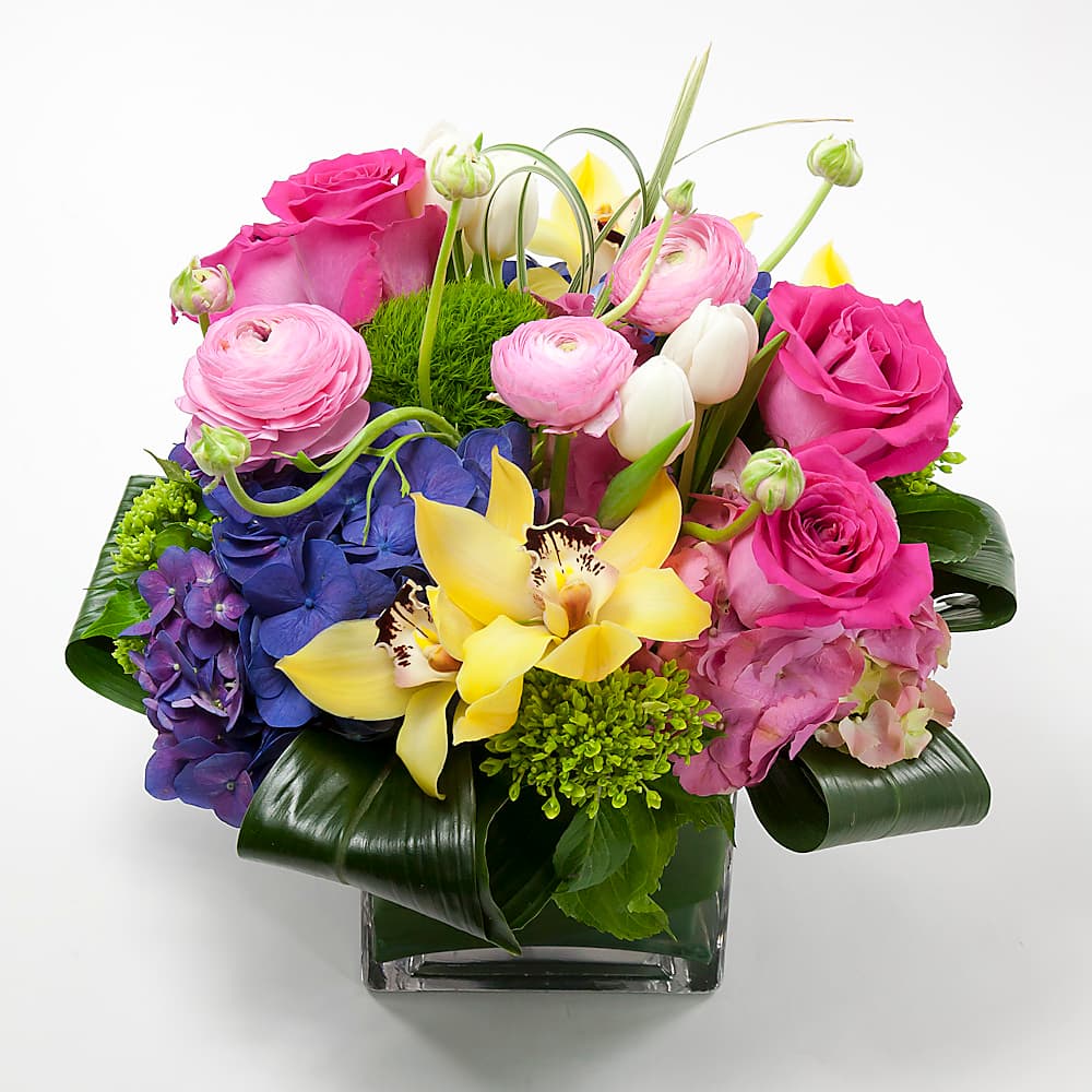 Floral Fiesta arrangement in magenta and marigold