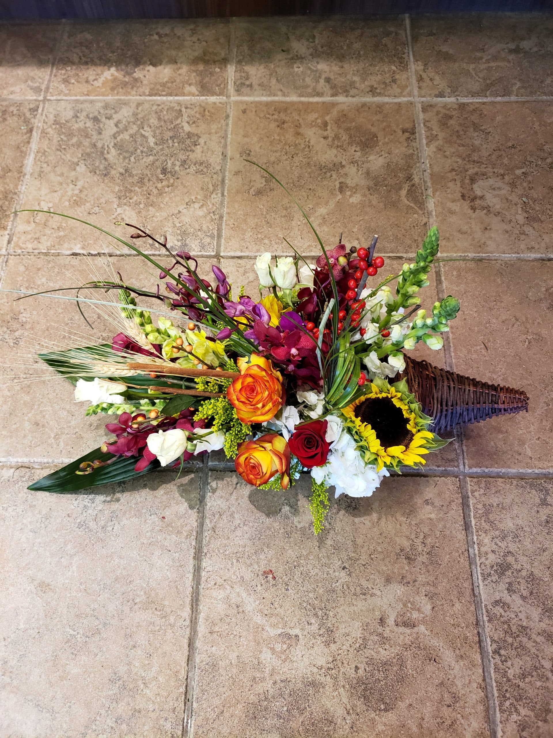 Nature's Cornucopia sympathy arrangement in earth tones