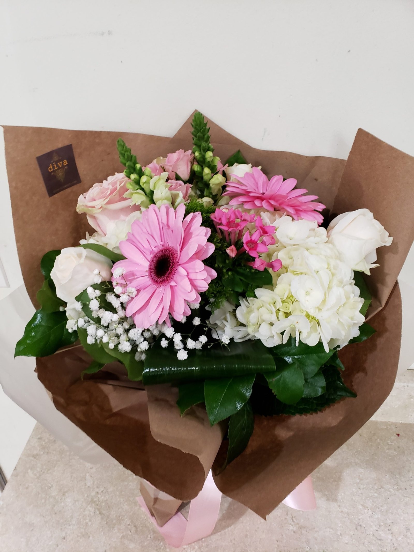 Petal Party bright pink arrangement of roses and gerberas