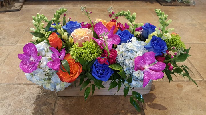Rainbow Reverie multicolor bouquet of roses and ranunculus