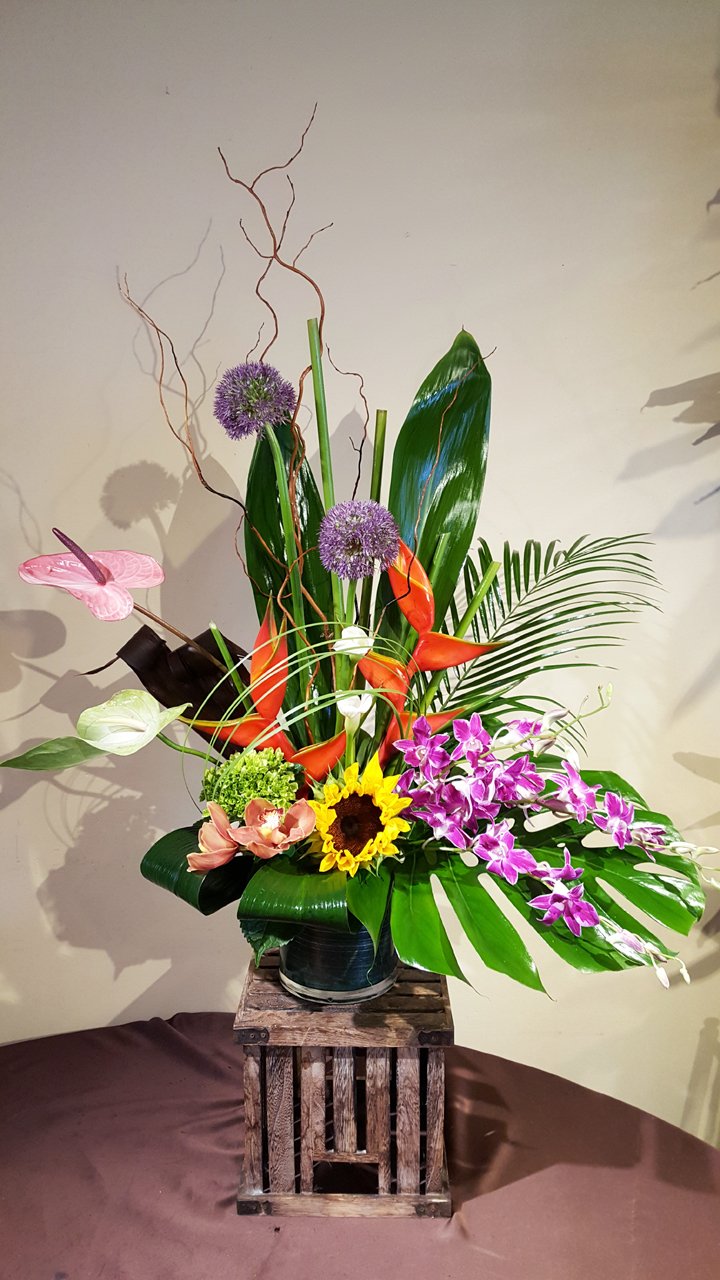 Tropic Thunder bold tropical arrangement with pink ginger and anthurium